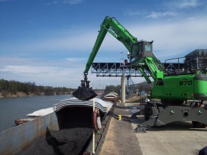 The hydraulically operated cab gives the operator a perfect view and once emptied, he just rolls down the dock to the next one.