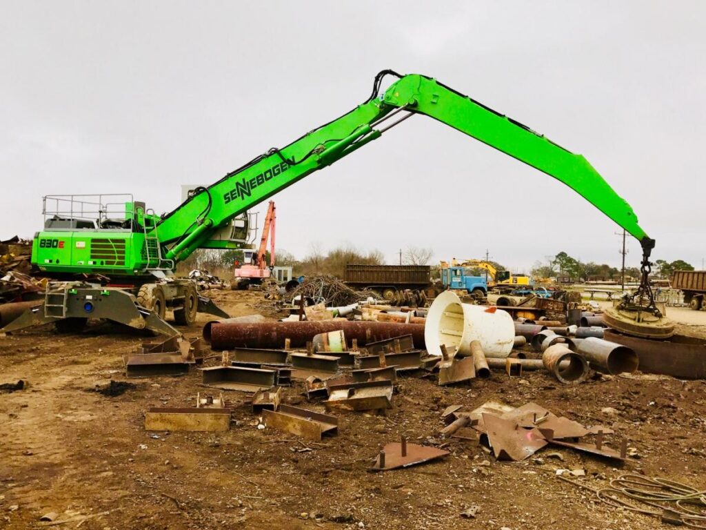 Configured with the right boom and stick, the operator can reach across and pick up everything.