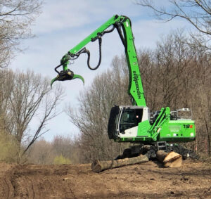 Jason Porter of Treeworks, Inc. uses a SENNEBOGEN 718 to "knock it out of the park." 