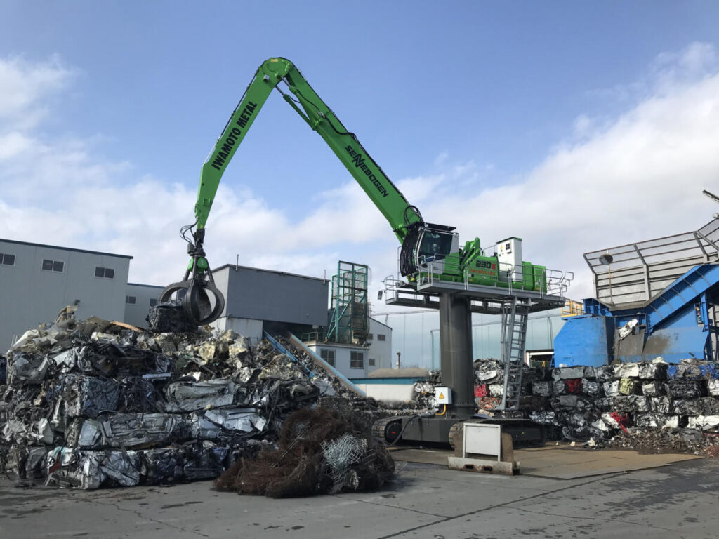 Material handler with a crawler undercarriage on a 15 foot (4.5 m) pylon powered by a 180 hp (132 kW) electric motor. This machine was purpose-built for the material handling conditions of Iwamoto Metal Co. Ltd.’s largest plant.