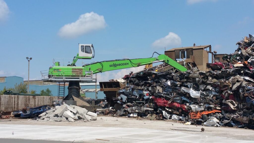 The combination of the boom and stick gives the operator the ability to reach and feed the shredder constantly.