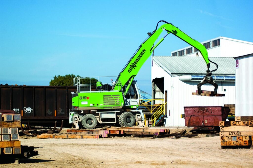 Roland Machinery helped Stella-Jones customize three SENNEBOGEN 818s for picking and loading rail ties with a customized grapple and a boom-mounted camera to give operators a better view into the rail cars they are loading.